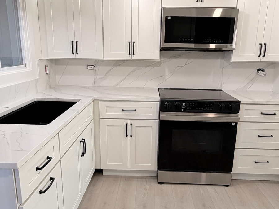 White kitchen remodel with stainless appliances in Lake County, IL