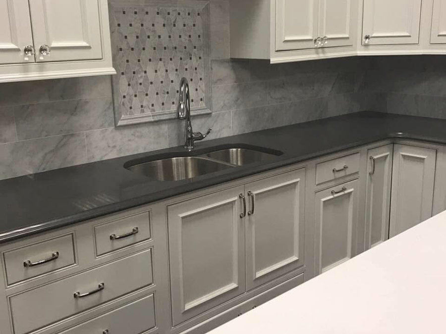 Gray and white kitchen remodel with dark countertops